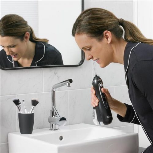 using-cordless-advanced-water-flosser-wp-562-black