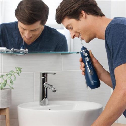 using-cordless-advanced-water-flosser-wp-563-blue